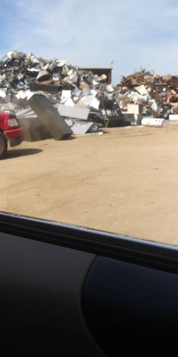 Metal scrap piled at a recycling yard.