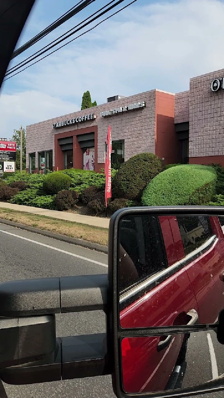 O'Reilly Auto Parts and Starbucks storefronts.