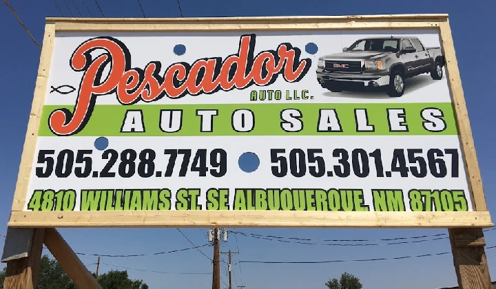 Pescador Auto LLC sign advertising junk car sales.