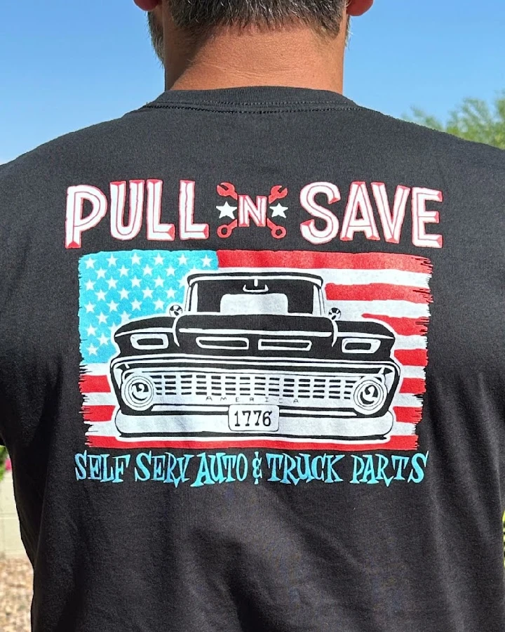 Pull N Save logo with vintage truck and flag design.