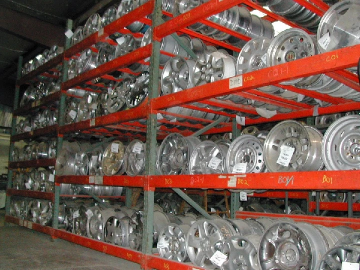 Racks of auto parts wheels at Buckeye Auto Parts.