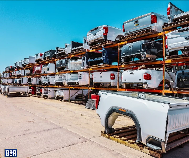 Rows of truck beds at B&R Auto Wrecking yard.