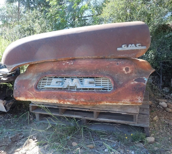 Rusty GMC truck parts at V & M Junkyard.