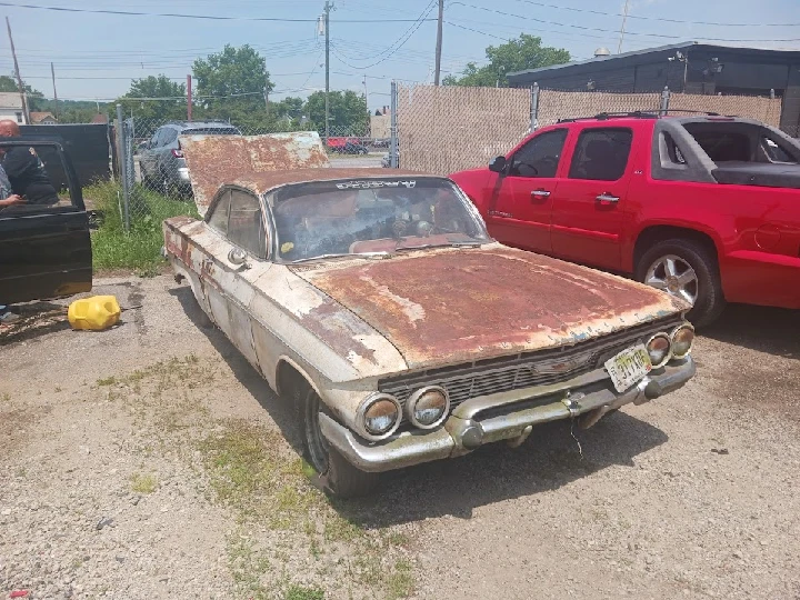 Rusty old junk car in a Cincinnati scrap yard.