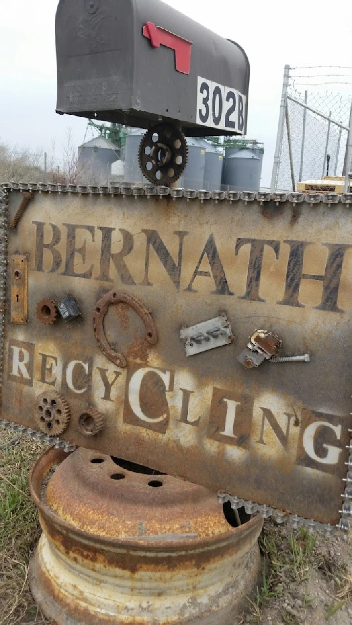 Rusty sign with Bernath Recycling and mailbox.