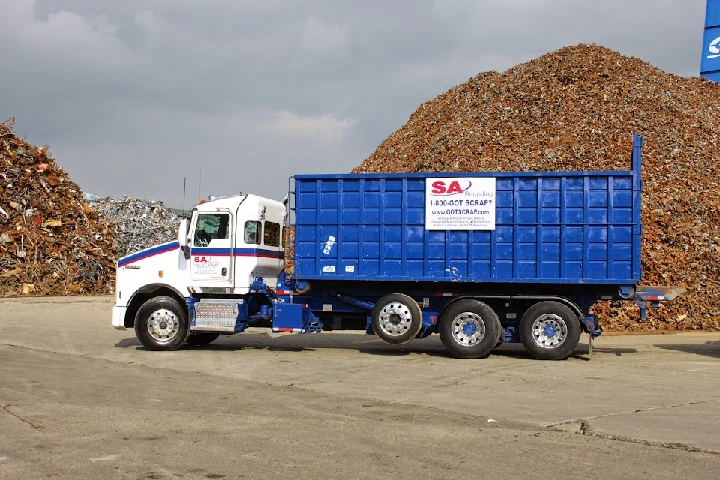 SA Recycling truck at a scrap metal site.