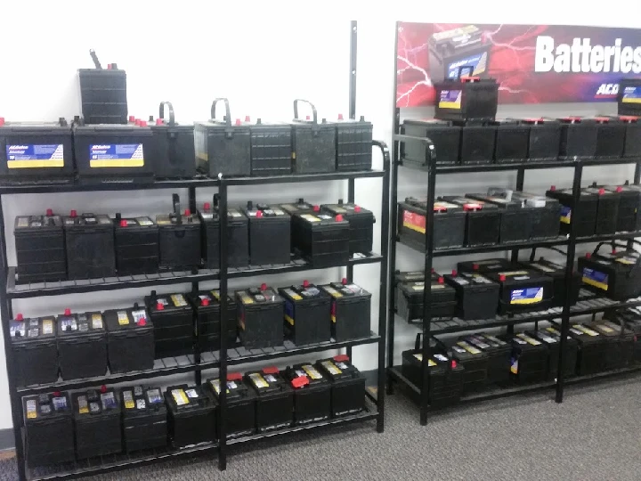 Shelves lined with various automotive batteries.