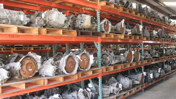 Shelves of recycled automotive engines and transmissions.