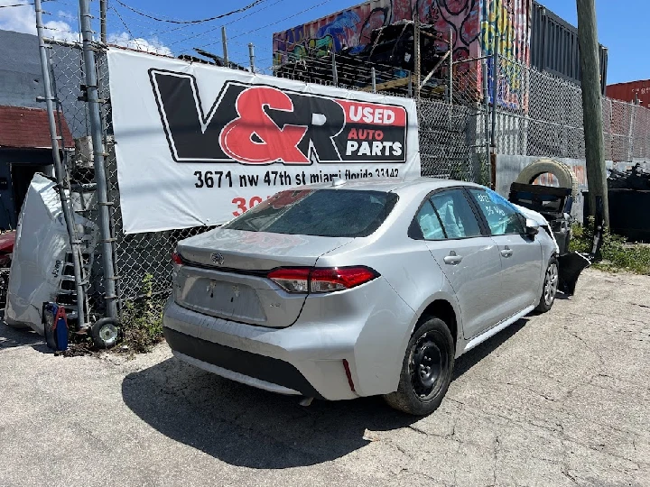 Silver sedan outside V & R Used Auto Parts Inc.