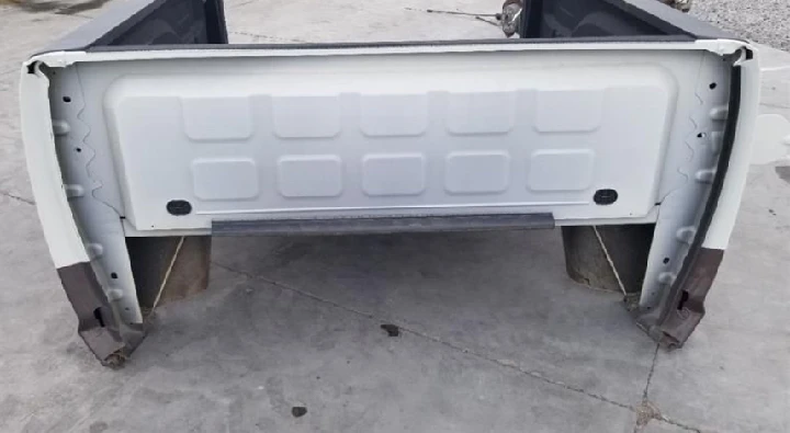 Truck bed interior view with mounting points.