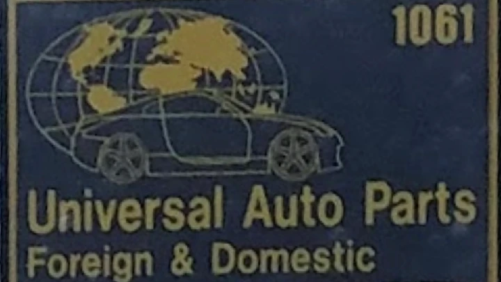 Universal Auto Parts logo with car and globe design.