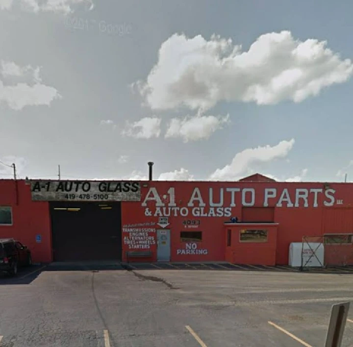 A-1 Auto Salvage storefront with services displayed.