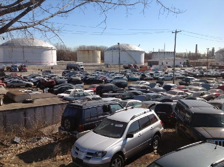 A busy junkyard filled with old vehicles.