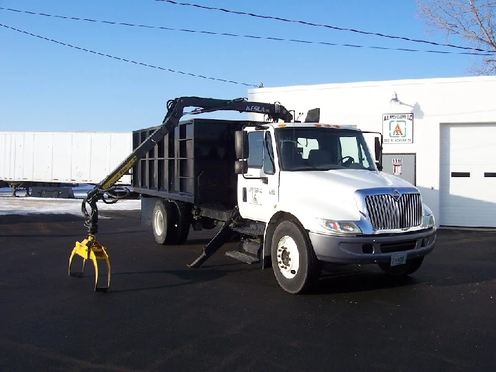 A1 Recyclers LLC truck with hydraulic arm.