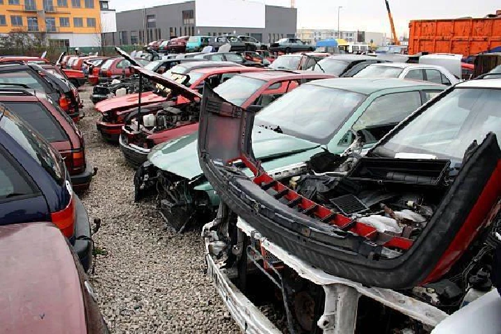 Abandoned cars in an auto salvage yard.