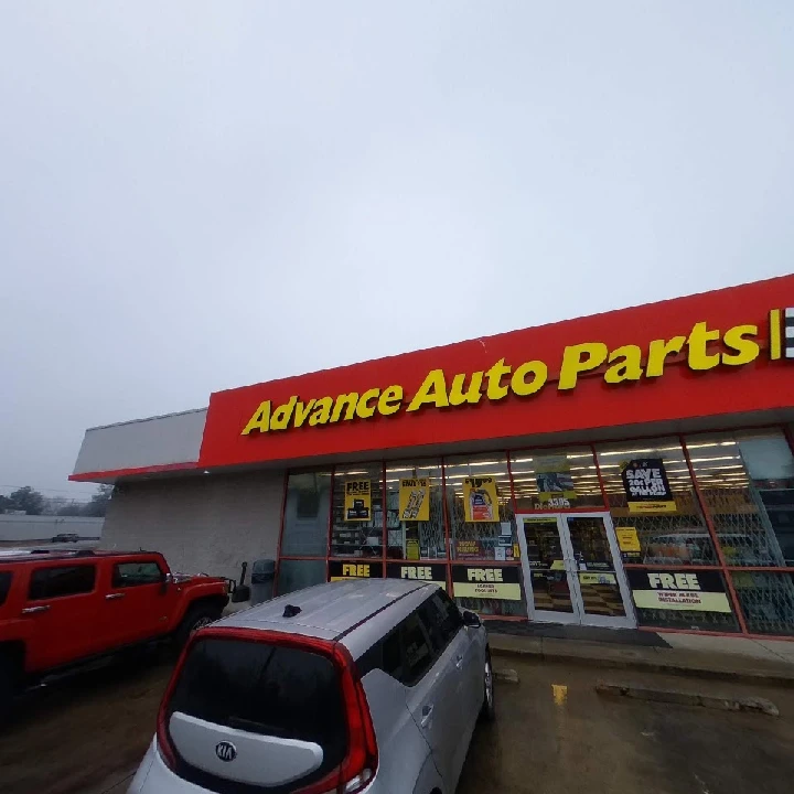 Advance Auto Parts store exterior with cars parked.