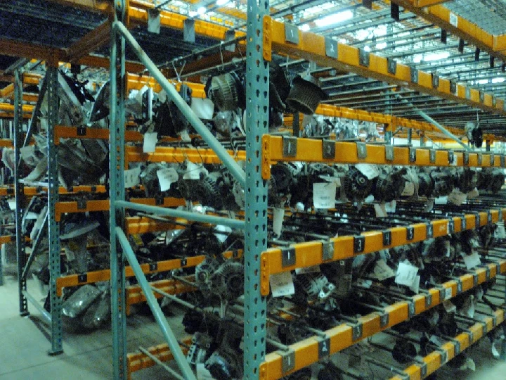 Auto parts organized on shelves in a warehouse.