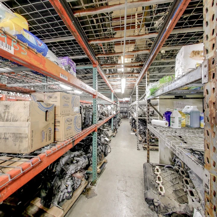 Auto parts and shelves in a dismantling warehouse.