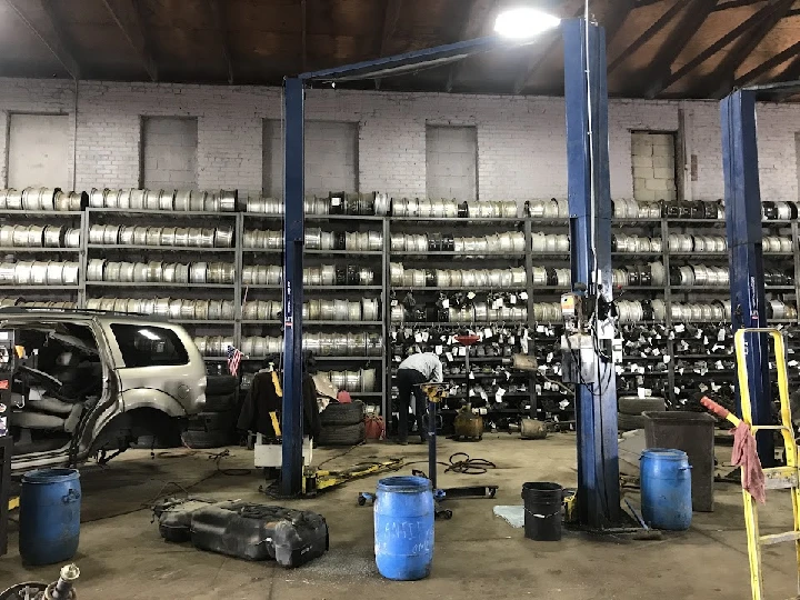 Auto parts shop interior with shelves and tools.