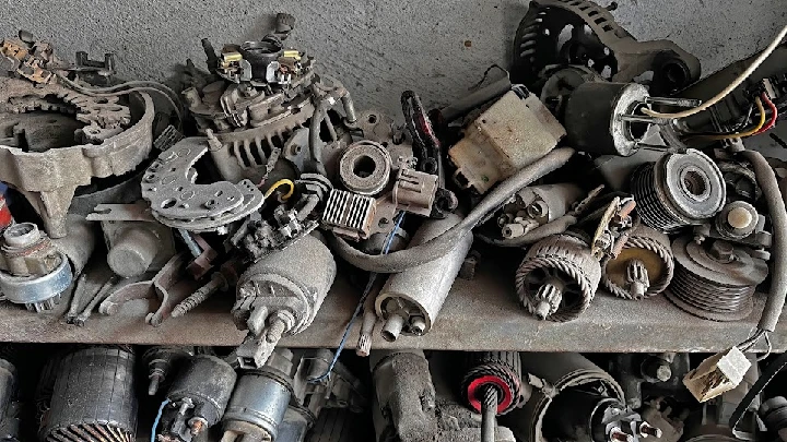 Auto parts stacked on a shelf at Alpha Used Auto Parts.