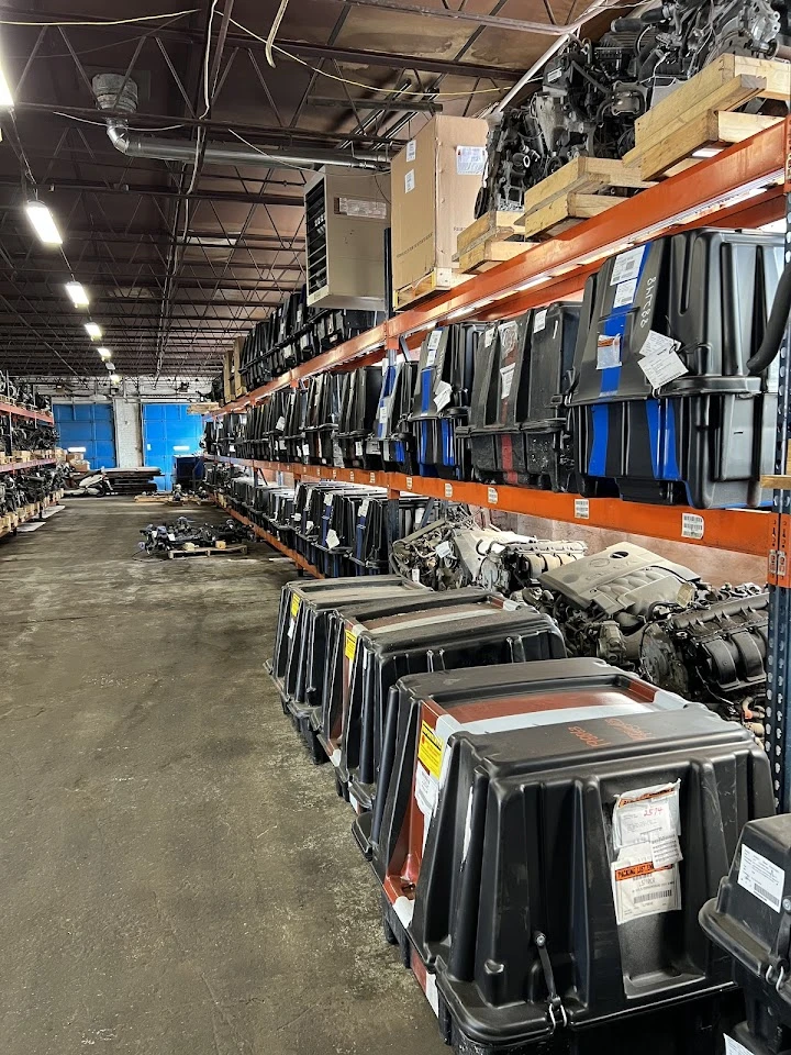 Auto parts storage facility with stacked containers.