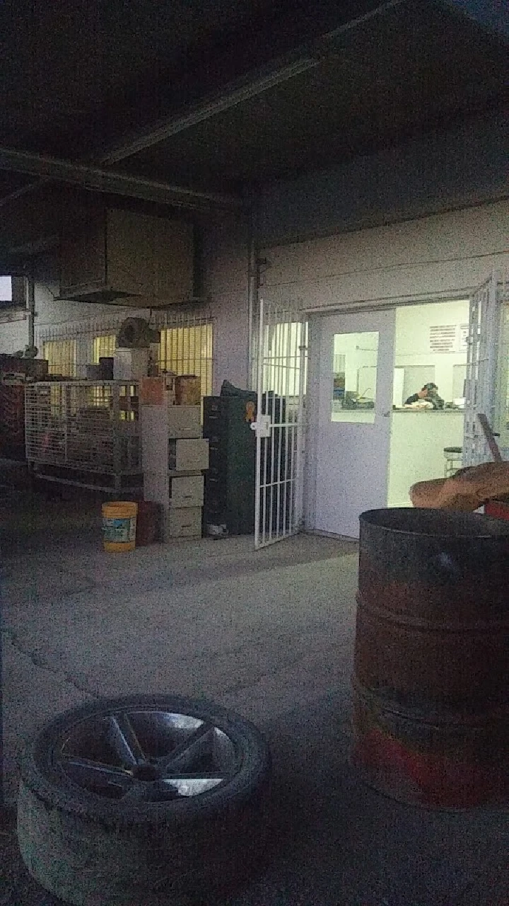 Auto parts store entrance with tires and supplies.