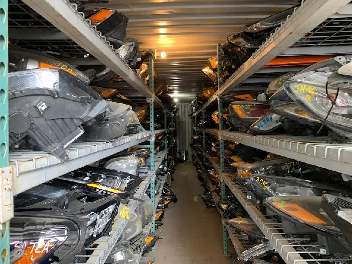 Auto parts stored on racks at G&K Used Auto Sale.