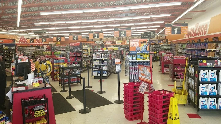 AutoZone store interior with shelves and checkout area.