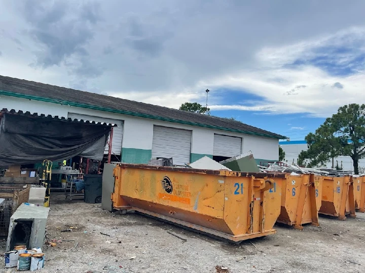 Brevard Metal Recycling facility with dumpsters.