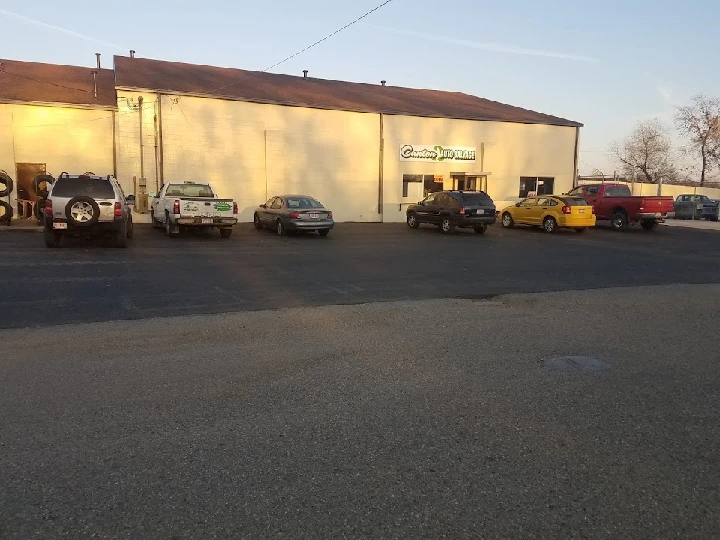 Canton Auto Salvage exterior with parked vehicles.