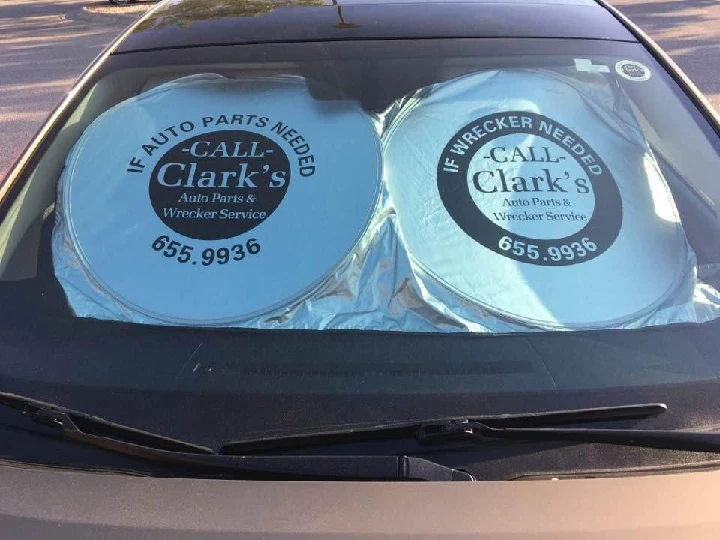 Clark's Auto Parts & Wrecker Service window sign.