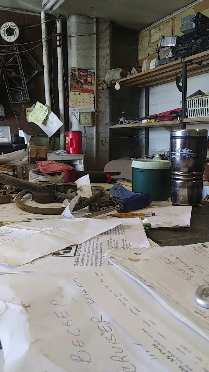 Cluttered workbench at Moltzan's Auto shop.