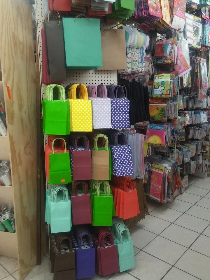 Colorful paper bags displayed in a store aisle.