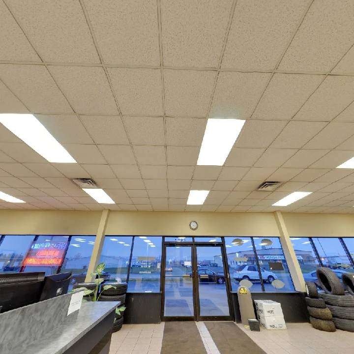 Cousineau Auto, Inc. interior with bright windows.