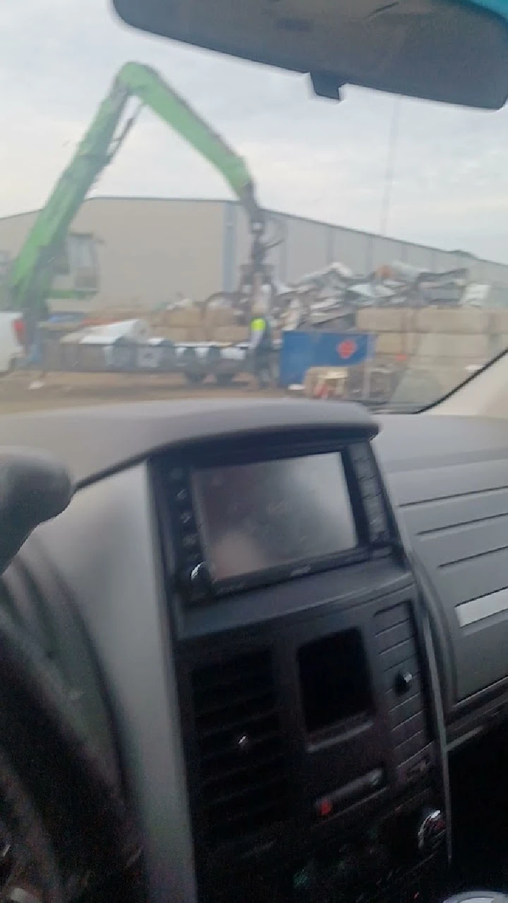 Crane loading metal at JSI Metal Recycling facility.