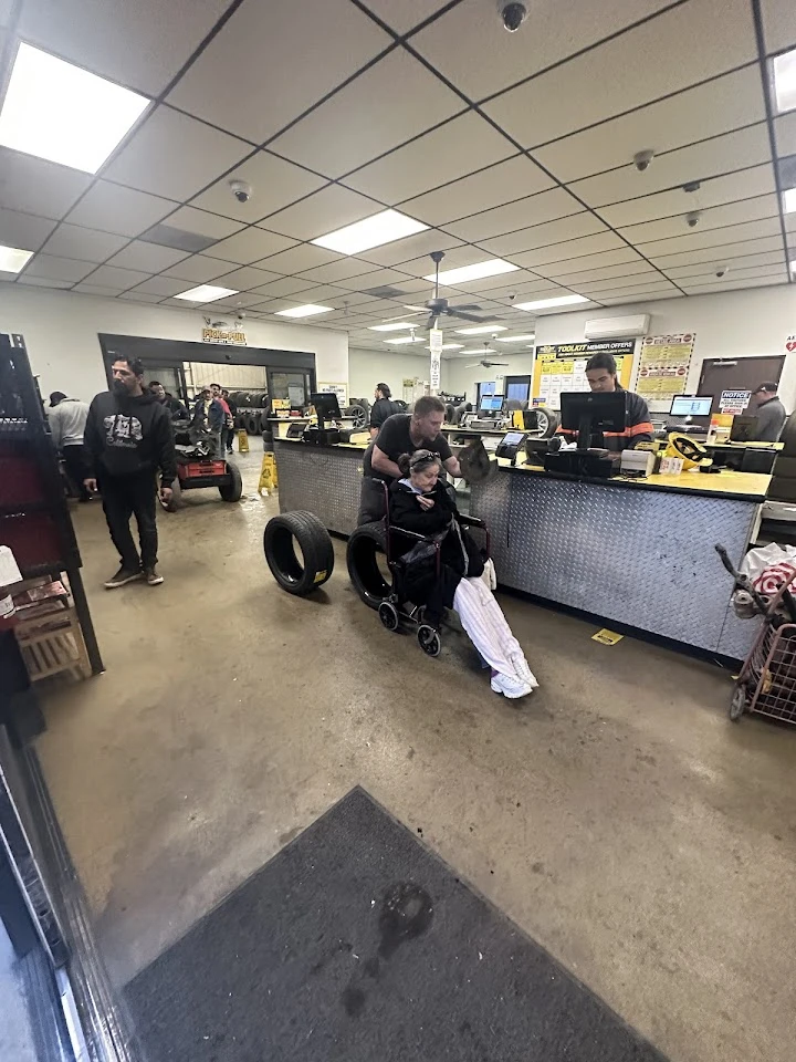 Customer service area at Pick-n-Pull with shoppers.