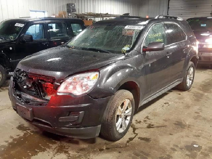 Damaged black SUV at A & D Truck & Auto Parts.