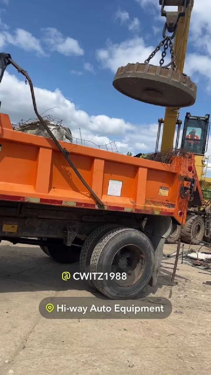 Dump truck and crane at Hi-Way Auto Equipment.