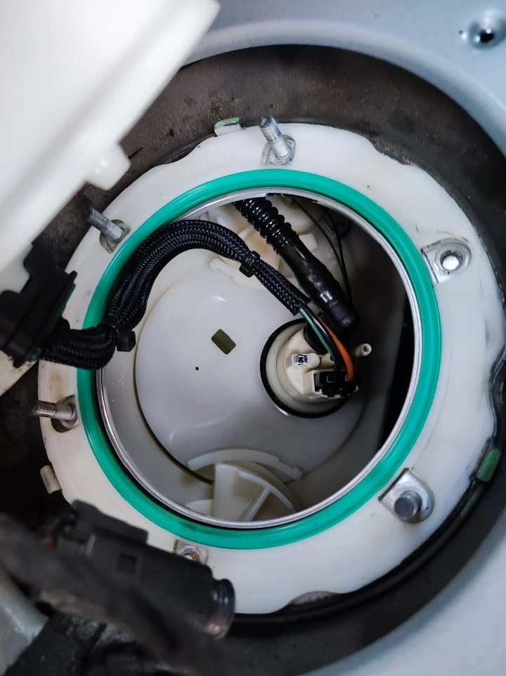 Fuel pump assembly inside a vehicle tank.