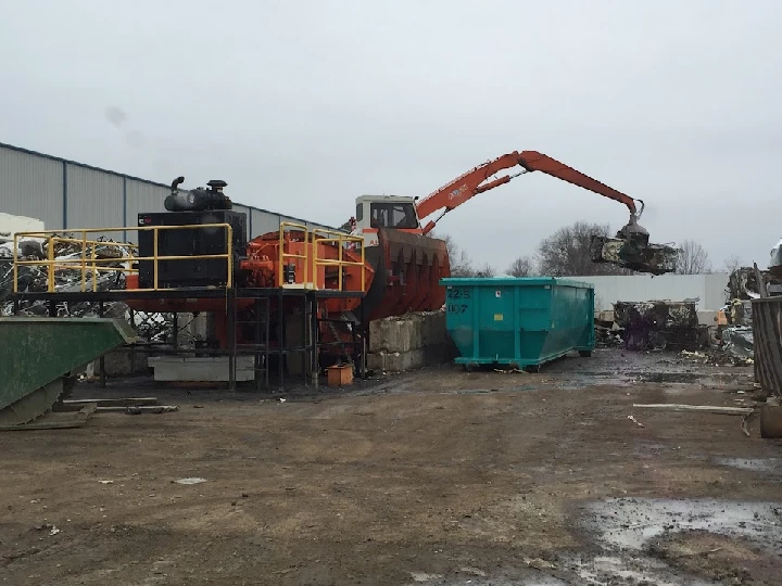 Heavy machinery at a metal recycling facility.