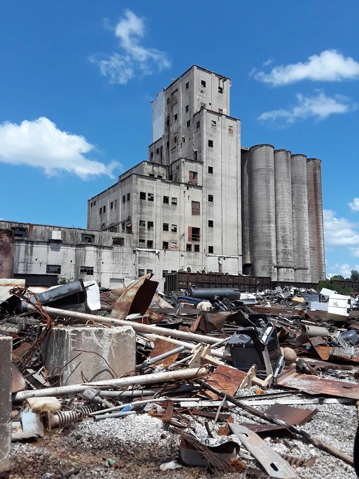 Industrial site with debris and old structures.