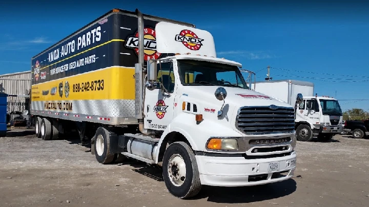 Knox Auto Parts delivery truck on a sunny day.