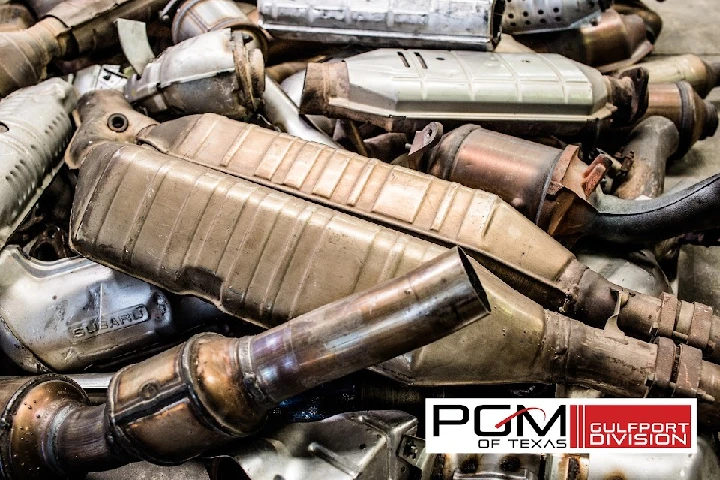 Metal automotive parts stacked together, labeled PGM.