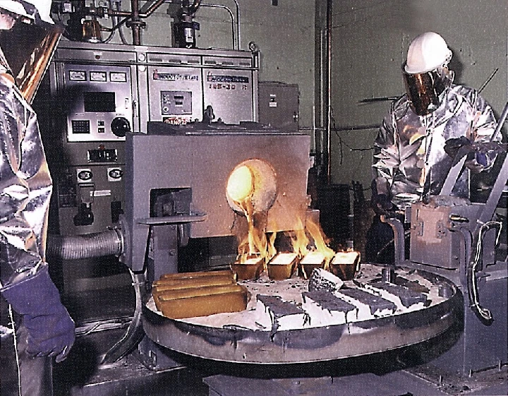 Metal pouring process in a manufacturing facility.