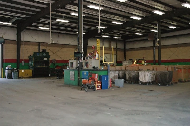 Metal recycling facility interior with equipment.