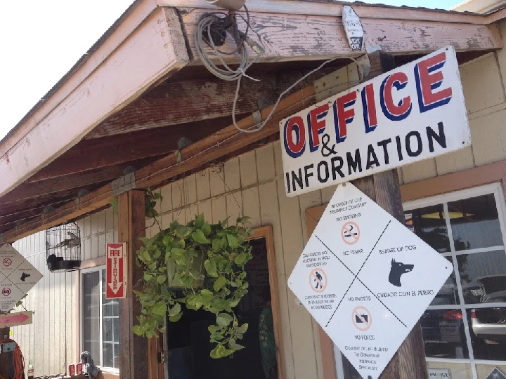 Office and information sign at auto parts wrecking.