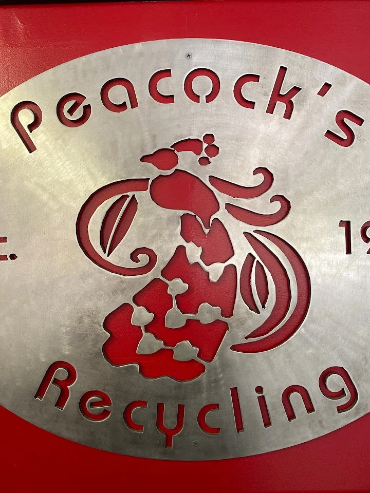 Peacock's Recycling logo on a red background.