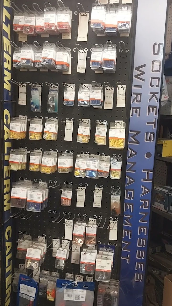 Pegboard display of automotive parts and accessories.