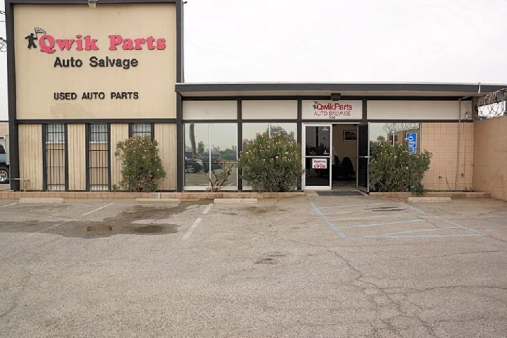 Qwikparts Auto Salvage storefront with signage.