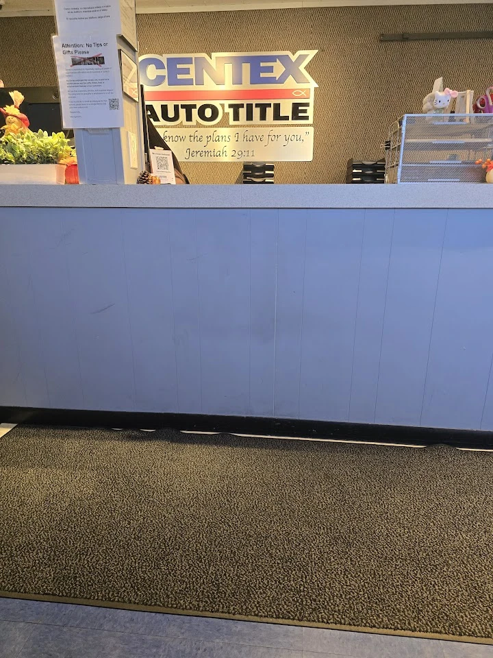 Reception area with a sign for Centex Auto Title.